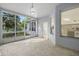 Screened porch with tile floor and view of backyard at 15214 Octavia Ln, Odessa, FL 33556