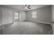 Bright bedroom with grey carpet and double door closet at 1702 E Fern St, Tampa, FL 33610