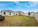 Fenced backyard with playset and grill at 17071 Oval Rum Dr, Wimauma, FL 33598