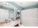 Clean bathroom with shower tub, vanity, and decorative accents at 17071 Oval Rum Dr, Wimauma, FL 33598