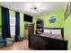 bedroom with dark wood bed and green walls at 17071 Oval Rum Dr, Wimauma, FL 33598