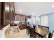 Kitchen boasts dark brown cabinets, granite countertops, and stainless steel appliances at 17071 Oval Rum Dr, Wimauma, FL 33598