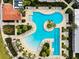 Aerial view of resort-style pool with multiple lounging areas at 17071 Oval Rum Dr, Wimauma, FL 33598