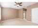 Spacious bedroom with ceiling fan and en-suite bath at 1748 Paladino Ct, Odessa, FL 33556