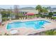 Inviting community pool with plenty of seating at 1748 Paladino Ct, Odessa, FL 33556