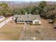 Aerial view of a single story home with a large backyard and a paved driveway at 17852 Fancy Ln, Hudson, FL 34667