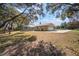House with a large backyard, screened pool, and detached garage at 17852 Fancy Ln, Hudson, FL 34667
