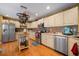 Spacious kitchen with an island, stainless steel appliances, and ample counter space at 17852 Fancy Ln, Hudson, FL 34667