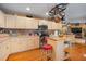 Well-equipped kitchen with an island, pot rack, and plenty of cabinet storage at 17852 Fancy Ln, Hudson, FL 34667