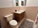 Simple bathroom with a sink, toilet, and tiled walls at 2042 Australia W Way # 78, Clearwater, FL 33763