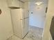 White kitchen with appliances, sink, and cabinets at 2042 Australia W Way # 78, Clearwater, FL 33763