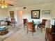 Living room with tiled floors, seating area, and dining table at 2042 Australia W Way # 78, Clearwater, FL 33763