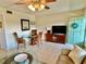 Open living area with seating, dining area, and tiled floors at 2042 Australia W Way # 78, Clearwater, FL 33763