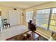 Living room with tiled floors, windows, and a view at 2042 Australia W Way # 78, Clearwater, FL 33763