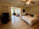 Spacious main bedroom with a king-size bed and an ensuite bathroom at 2042 Australia W Way # 78, Clearwater, FL 33763