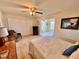 Main bedroom with a king-size bed, and access to another room at 2042 Australia W Way # 78, Clearwater, FL 33763