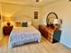 Main bedroom with a king-size bed and large dresser at 2042 Australia W Way # 78, Clearwater, FL 33763