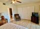 Main bedroom with a king bed, seating area, and ensuite bath at 2042 Australia W Way # 78, Clearwater, FL 33763