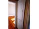 Hallway featuring hardwood floors and a built-in linen closet at 320 24Th N St, St Petersburg, FL 33713