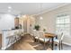 Dining area with a wooden table and six chairs near the kitchen at 3210 W Horatio St # 1, Tampa, FL 33609