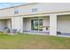 Backyard view of townhouses with patios at 34395 Sorrel Mint Dr, Wesley Chapel, FL 33543