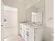 Double vanity bathroom with a large mirror at 34395 Sorrel Mint Dr, Wesley Chapel, FL 33543