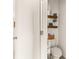Small bathroom with floating shelves and stylish decor at 34395 Sorrel Mint Dr, Wesley Chapel, FL 33543