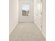 Simple bedroom with window and double doors at 34395 Sorrel Mint Dr, Wesley Chapel, FL 33543