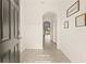 Bright and airy entryway with tile flooring and arched doorways at 34395 Sorrel Mint Dr, Wesley Chapel, FL 33543