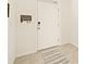 Front entry with tile floors and a welcome home sign at 34395 Sorrel Mint Dr, Wesley Chapel, FL 33543
