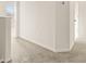 Upstairs hallway with neutral carpeting at 34395 Sorrel Mint Dr, Wesley Chapel, FL 33543