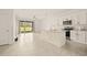 Modern kitchen with white cabinets, granite island, and stainless steel appliances at 34395 Sorrel Mint Dr, Wesley Chapel, FL 33543