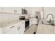 Modern kitchen with stainless steel appliances and granite countertops at 34395 Sorrel Mint Dr, Wesley Chapel, FL 33543