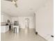 Open concept living area with kitchen and stairs to upper level at 34395 Sorrel Mint Dr, Wesley Chapel, FL 33543