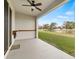 Covered patio overlooking a pond at 34395 Sorrel Mint Dr, Wesley Chapel, FL 33543