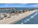 Aerial view of beach, ocean, and coastal city at 400 Island Way # 903, Clearwater Beach, FL 33767