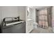 Modern bathroom with shower, toilet and washer/dryer at 400 Island Way # 903, Clearwater Beach, FL 33767