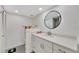 Modern bathroom with white vanity and large mirror at 400 Island Way # 903, Clearwater Beach, FL 33767