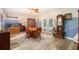 Dining room featuring a round wooden table and access to backyard at 413 Pryor St, Brooksville, FL 34601