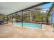 Inviting screened pool area with plenty of space for relaxation at 413 Pryor St, Brooksville, FL 34601