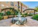 Community courtyard with fountain and seating area at 4221 W Spruce St # 1404, Tampa, FL 33607