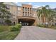 Building exterior featuring an arched entryway and landscaping at 4221 W Spruce St # 1404, Tampa, FL 33607