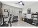 Home office featuring a standing desk, wood wall accents, and ample storage at 4221 W Spruce St # 1404, Tampa, FL 33607