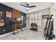 Home office with standing desk, built-in shelving, and plenty of natural light at 4221 W Spruce St # 1404, Tampa, FL 33607