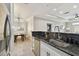 Modern kitchen with breakfast bar and stainless steel appliances at 4221 W Spruce St # 1404, Tampa, FL 33607