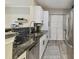 Modern kitchen with white shaker cabinets and granite countertops at 4221 W Spruce St # 1404, Tampa, FL 33607