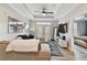 Bright living room with comfortable seating, large TV, and access to a balcony at 4221 W Spruce St # 1404, Tampa, FL 33607