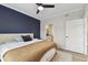Spacious main bedroom with a plush bed and access to a private bathroom at 4221 W Spruce St # 1404, Tampa, FL 33607