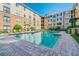 Community pool with plenty of lounge chairs at 4221 W Spruce St # 1404, Tampa, FL 33607