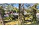Bird's-eye view showcasing the home's setting among trees and neighboring buildings at 4307 W Kensington Ave, Tampa, FL 33629